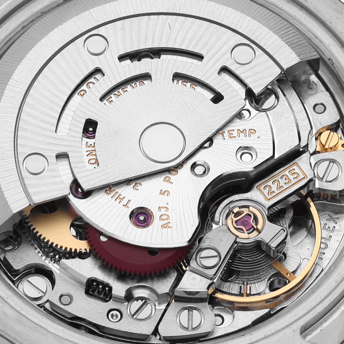 The image shows the intricate movement of a Rolex Datejust 179174 Women's Stainless Steel Mother of Pearl Dial 179174 Women's Stainless Steel Mother of Pearl Dial, focusing on the rotor and balance wheel from a top-down angle.