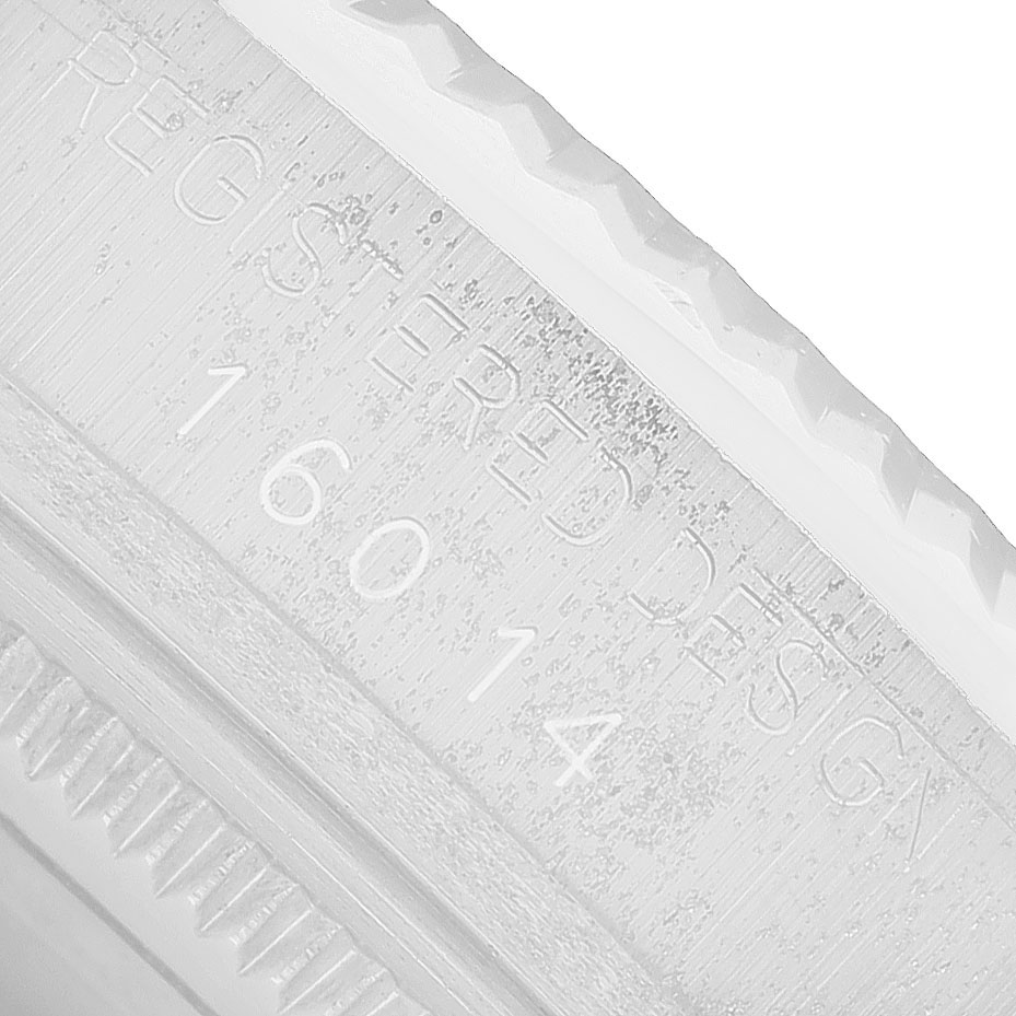 The image shows a close-up of the side with engraved serial numbers for the Rolex Datejust 16014 Men's Stainless Steel Silver Dial watch.
