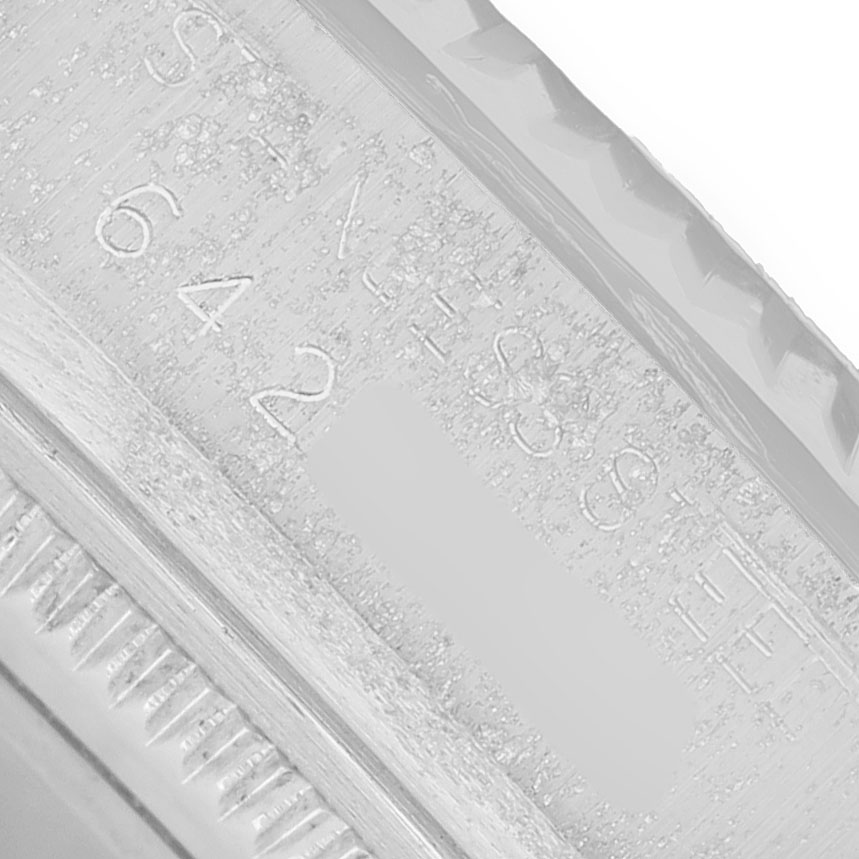 The image shows a close-up of the engraved inner bezel of a Rolex Datejust 16014 Men's Stainless Steel Silver Dial watch.