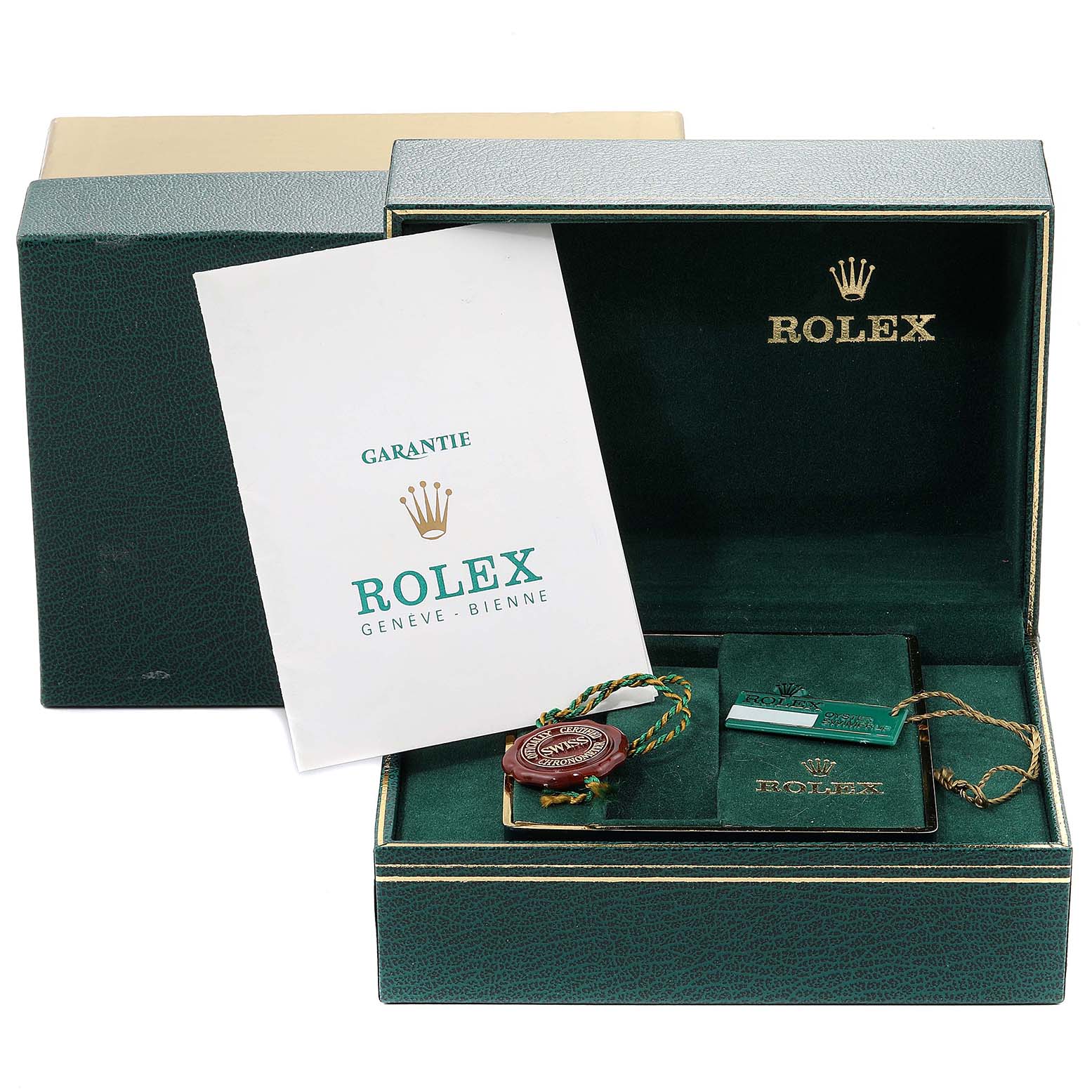 The image shows a Rolex Datejust 16013 Men's Steel and Gold (two tone) Black Dial 16013 Men's Steel and Gold (two tone) Black Dial accessories box with a manual, hang tag, and warranty card, all placed at an angle inside the open green box.