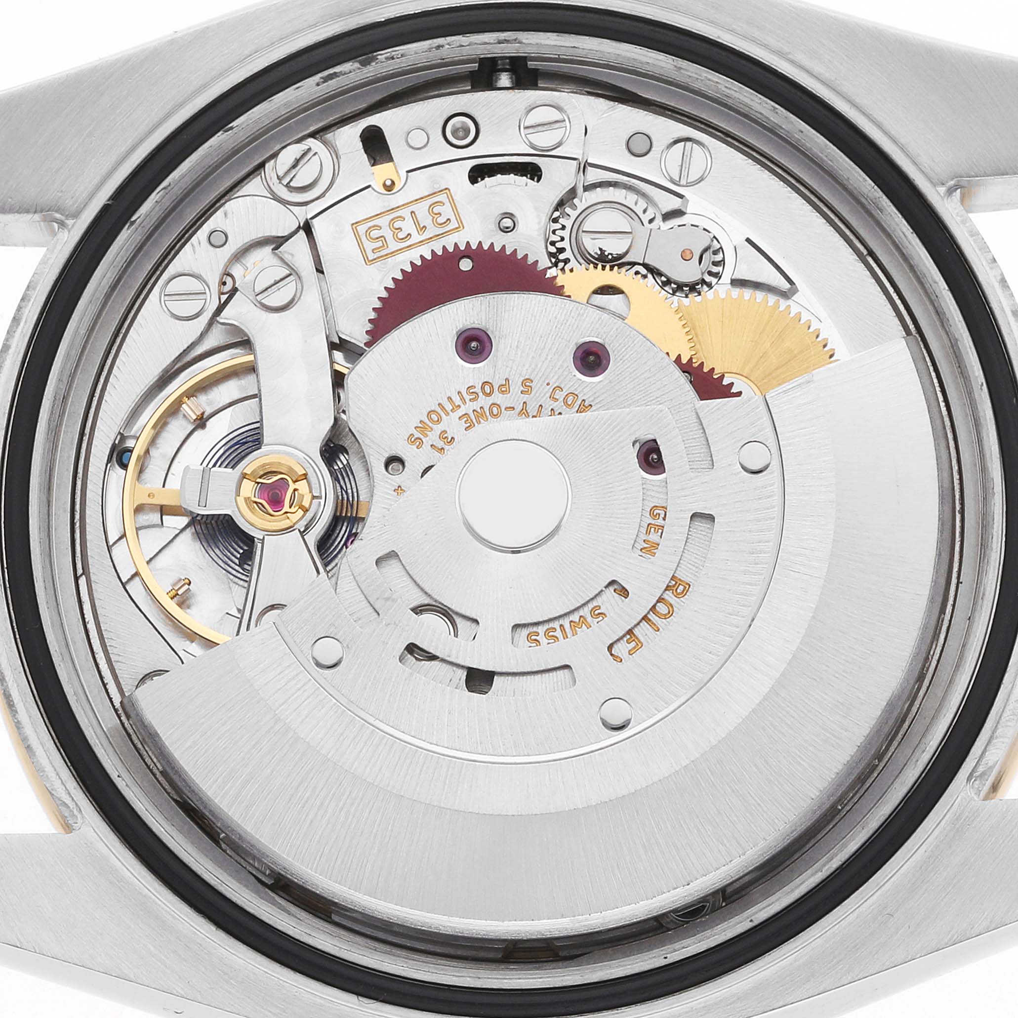 The image shows a top-down view of the internal mechanism of a Rolex Datejust 116243 Men
s Steel and Gold (two tone) Champagne Dial watch, highlighting gears and components.