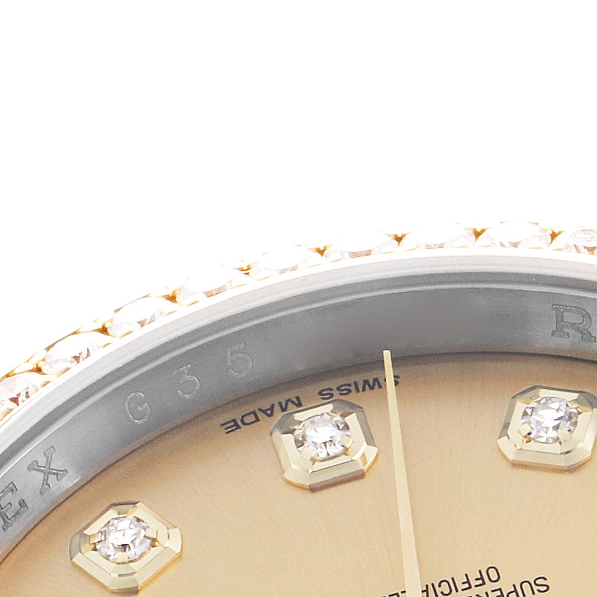 The image shows a close-up of the Rolex Datejust 116243 Men
s Steel and Gold (two tone) Champagne Dial dial, highlighting diamond hour markers and part of the bezel.
