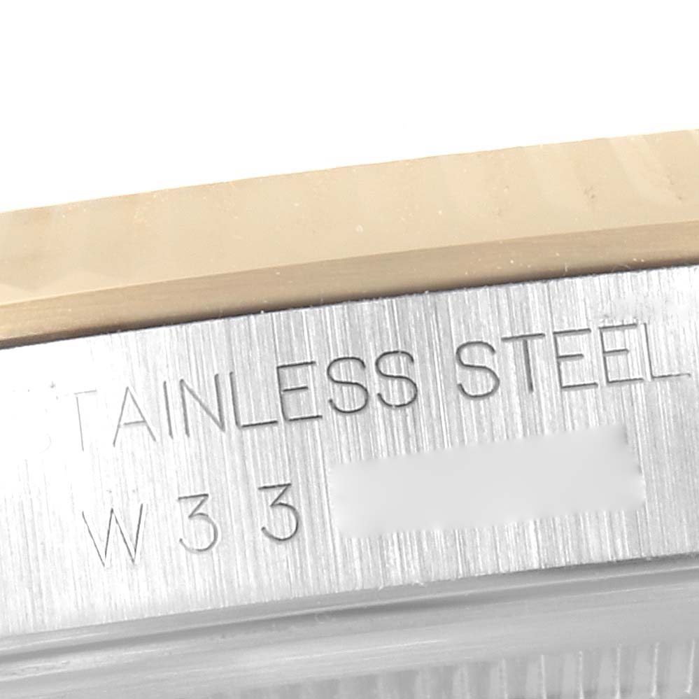 This close-up image shows the stainless steel casing of a Rolex Datejust 16233 Men's Steel and Gold (two tone) Champagne Dial 16233 Men's Steel and Gold (two tone) Champagne Dial watch.