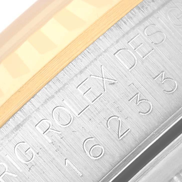 This image shows a close-up of the engraved inner bezel of a Rolex Datejust 16233 Men
s Steel and Gold (two tone) Champagne Dial 16233 Men
s Steel and Gold (two tone) Champagne Dial watch with visible model details.