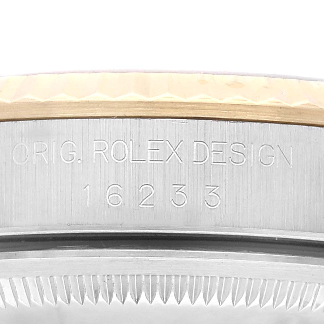 This image shows a close-up of the side case and engraved serial number of a Rolex Datejust 16233 Men's Steel and Gold (two tone) Champagne Dial 16233 Men's Steel and Gold (two tone) Champagne Dial watch, model 16233.
