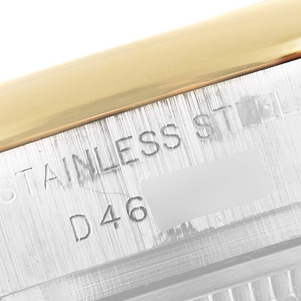 This close-up angle shows the serial number and "STAINLESS STEEL" engraving on the side of a Rolex Datejust 179163 Women
s Steel and Gold (two tone) Grey Dial 179163 Women
s Steel and Gold (two tone) Grey Dial watch case.