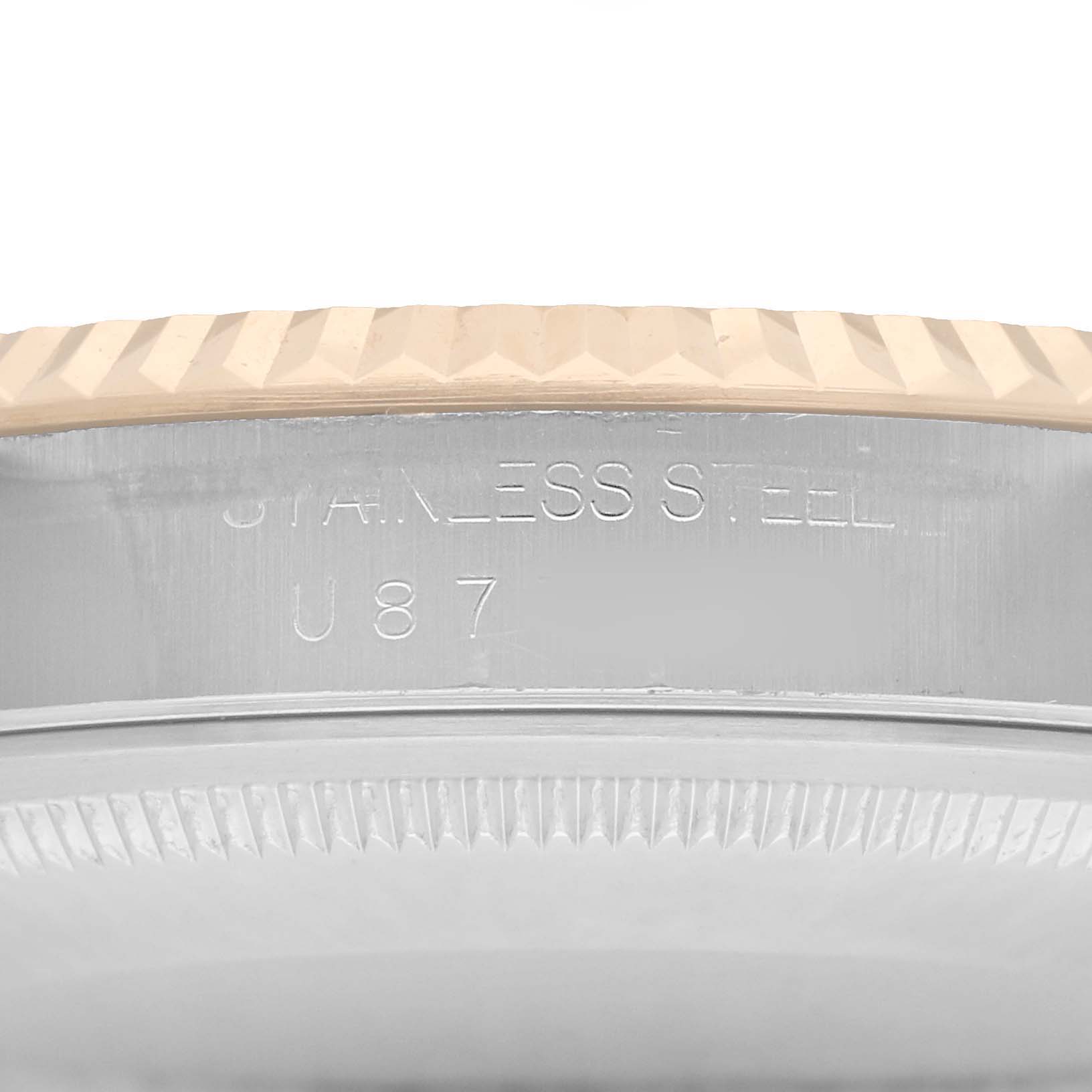 The image shows a close-up of the side of a Rolex Datejust 16233 Men
s Steel and Gold (two tone) White Dial, highlighting the stainless steel casing and bezel text.