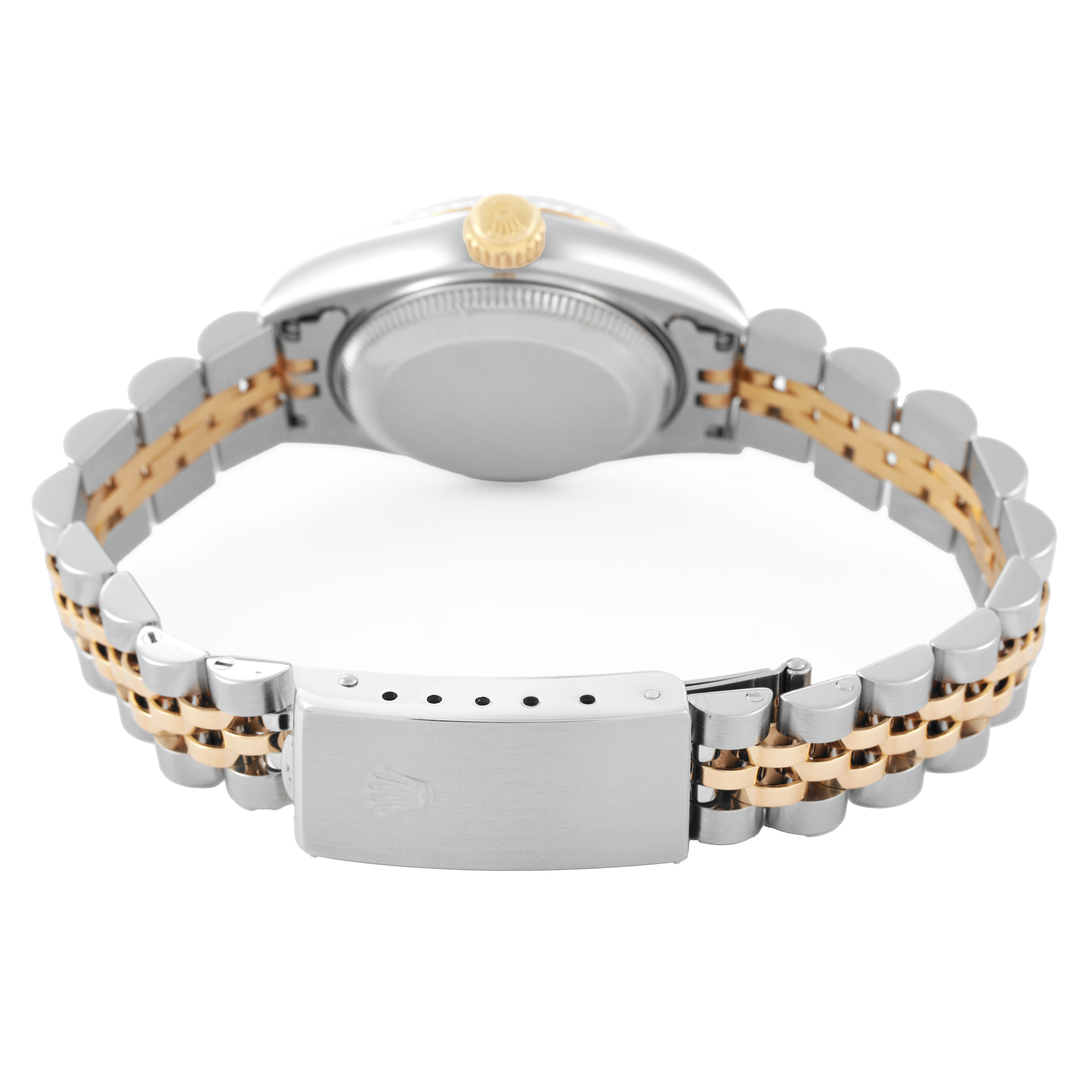 The Rolex Datejust 69173 Women's Steel and Gold (two tone) White Dial watch is shown from the back, highlighting the clasp and two-tone metal bracelet.