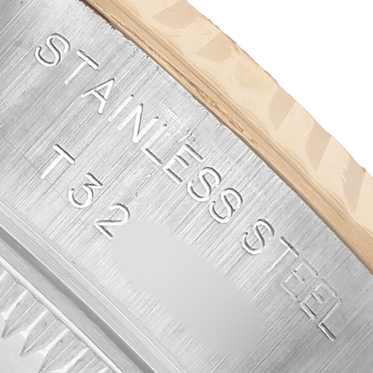 The image shows a close-up of the side of a Rolex Datejust 69173 Women's Steel and Gold (two tone) White Dial watch, highlighting its stainless steel and fluted bezel.