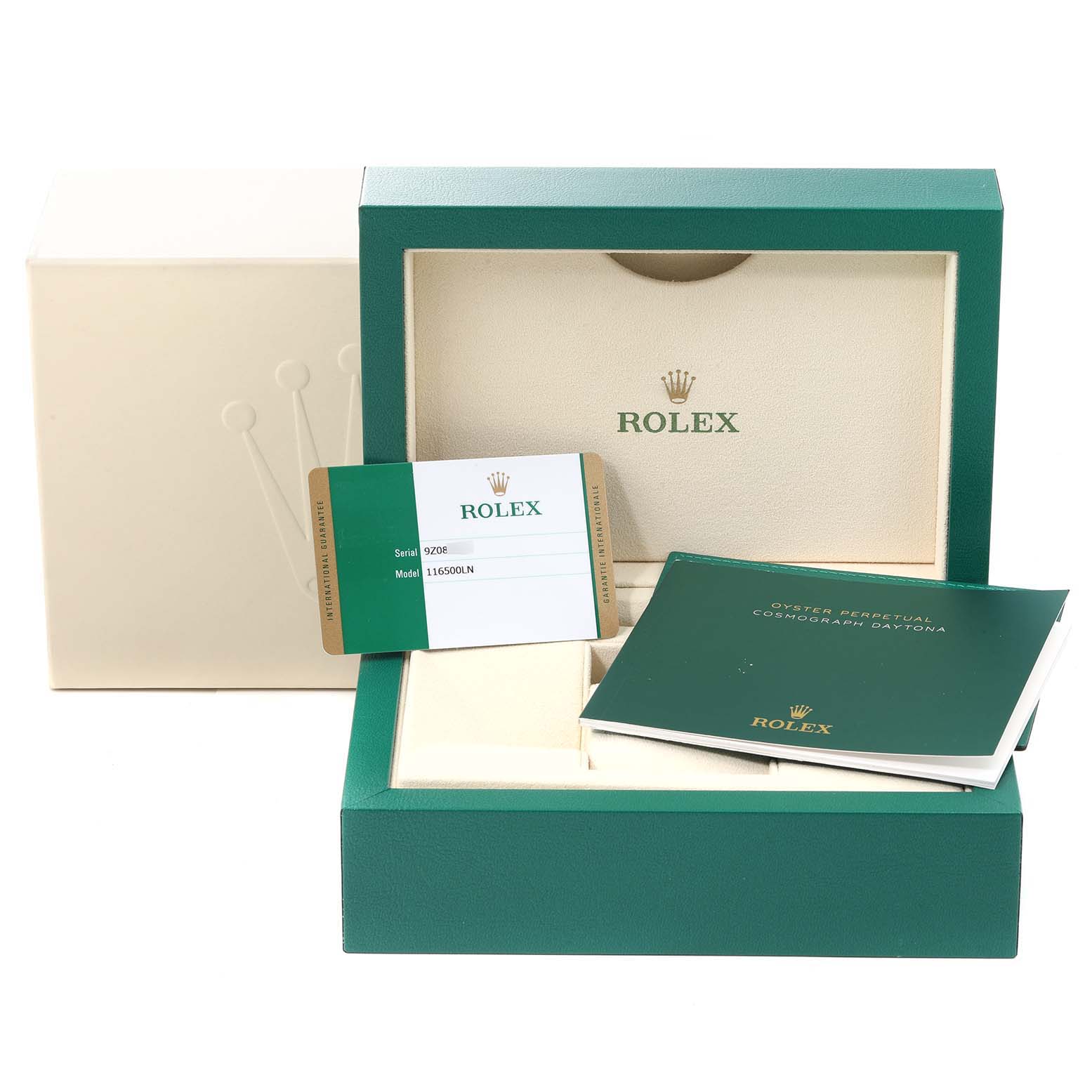 The image shows the packaging, warranty card, and manual for a Rolex Daytona 116500 Men
s Stainless Steel White Dial 116500 Men
s Stainless Steel White Dial watch, with a view of the box
s interior.