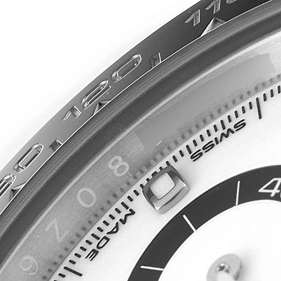 This close-up angle shows the dial and bezel of the Rolex Daytona 116500 Men
s Stainless Steel White Dial 116500 Men
s Stainless Steel White Dial watch highlighting numbers and the "SWISS MADE" text.