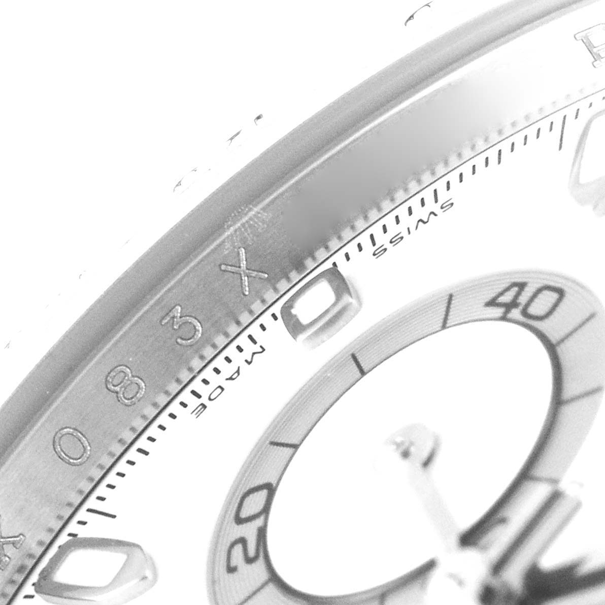 This image shows a close-up angle of the dial and bezel of a Rolex Daytona 116520 Men's Stainless Steel White Dial 116520 Men's Stainless Steel White Dial watch.
