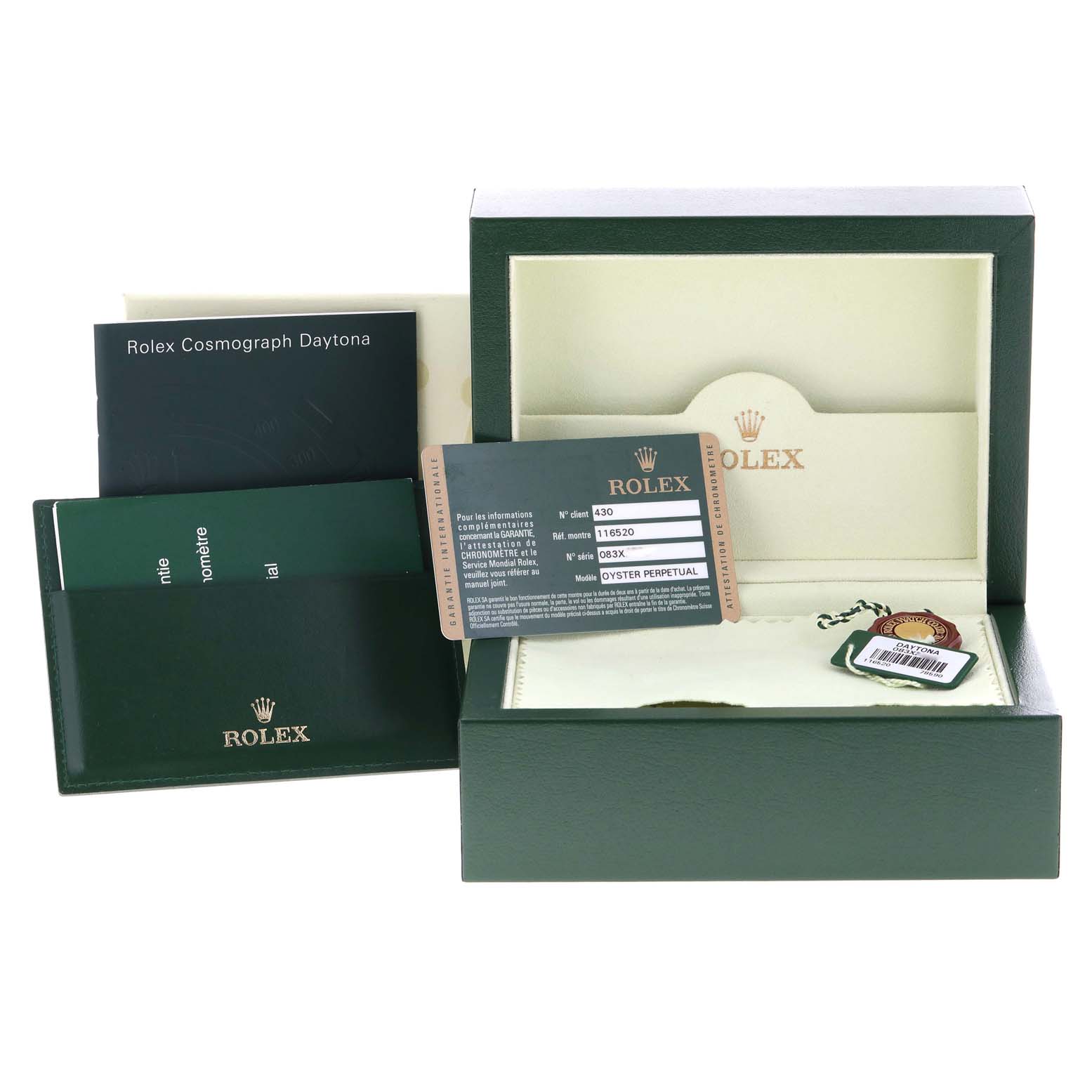 The image shows a Rolex Daytona 116520 Men's Stainless Steel White Dial 116520 Men's Stainless Steel White Dial watch box, warranty card, manuals, and tags at a slightly elevated angle.