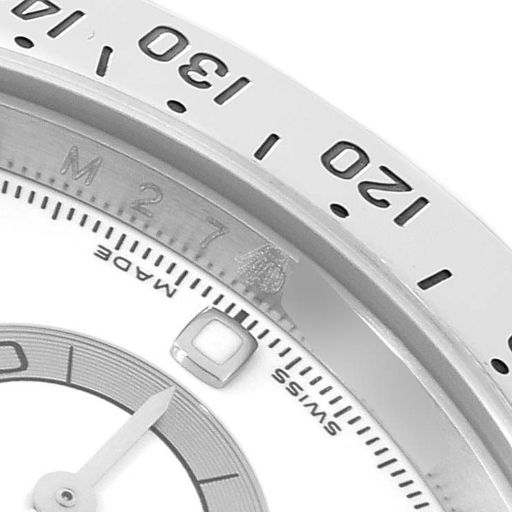 Close-up angle showing the bezel, dial, and part of the hand of a Rolex Daytona 116520 Men's Stainless Steel White Dial 116520 Men's Stainless Steel White Dial watch.