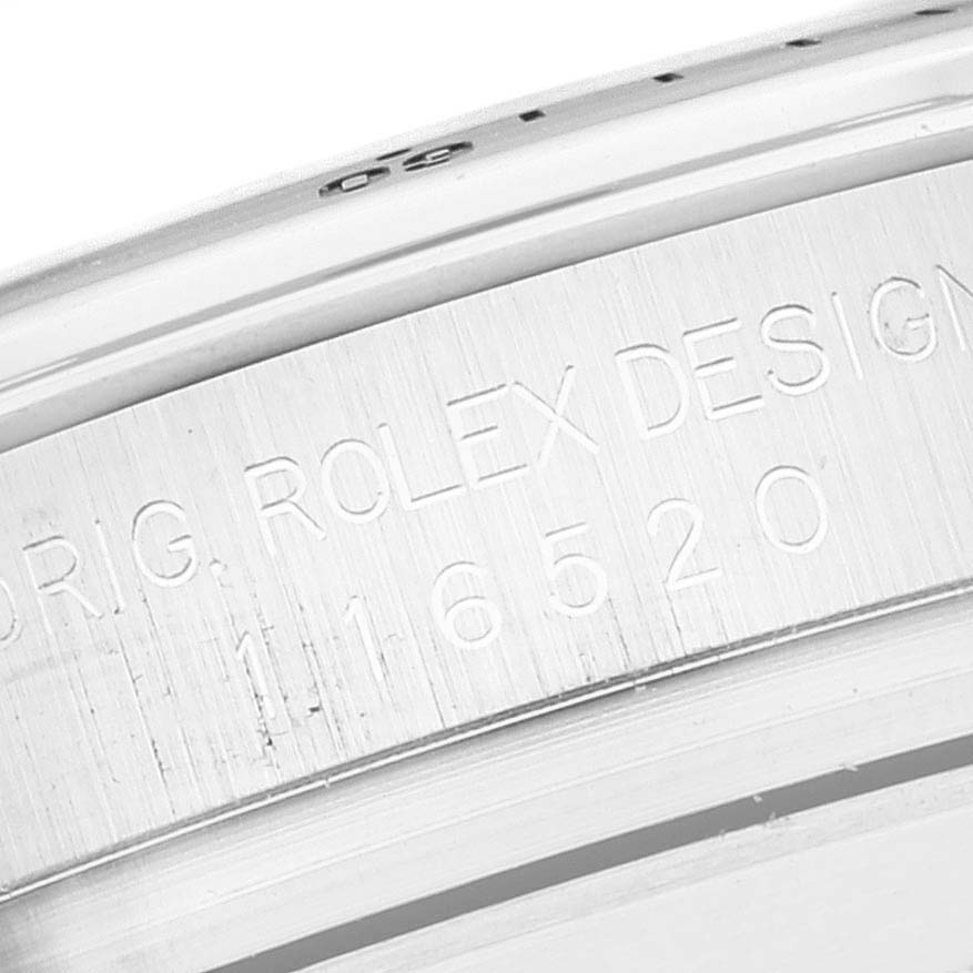 This close-up image shows the side engraving and bezel of the Rolex Daytona 116520 Men's Stainless Steel White Dial 116520 Men's Stainless Steel White Dial watch, displaying the model number "116520".