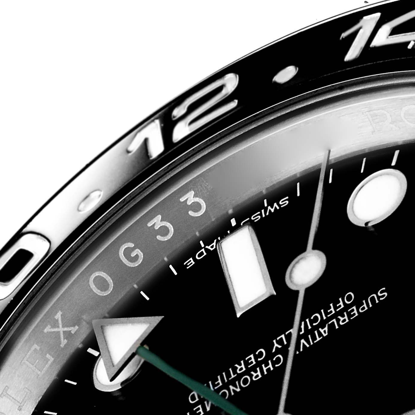 This close-up of the Rolex GMT-Master 116710 Men
s Stainless Steel Black Dial 116710 Men
s Stainless Steel Black Dial shows part of the dial, indices, hands, and a section of the bezel with numerals.