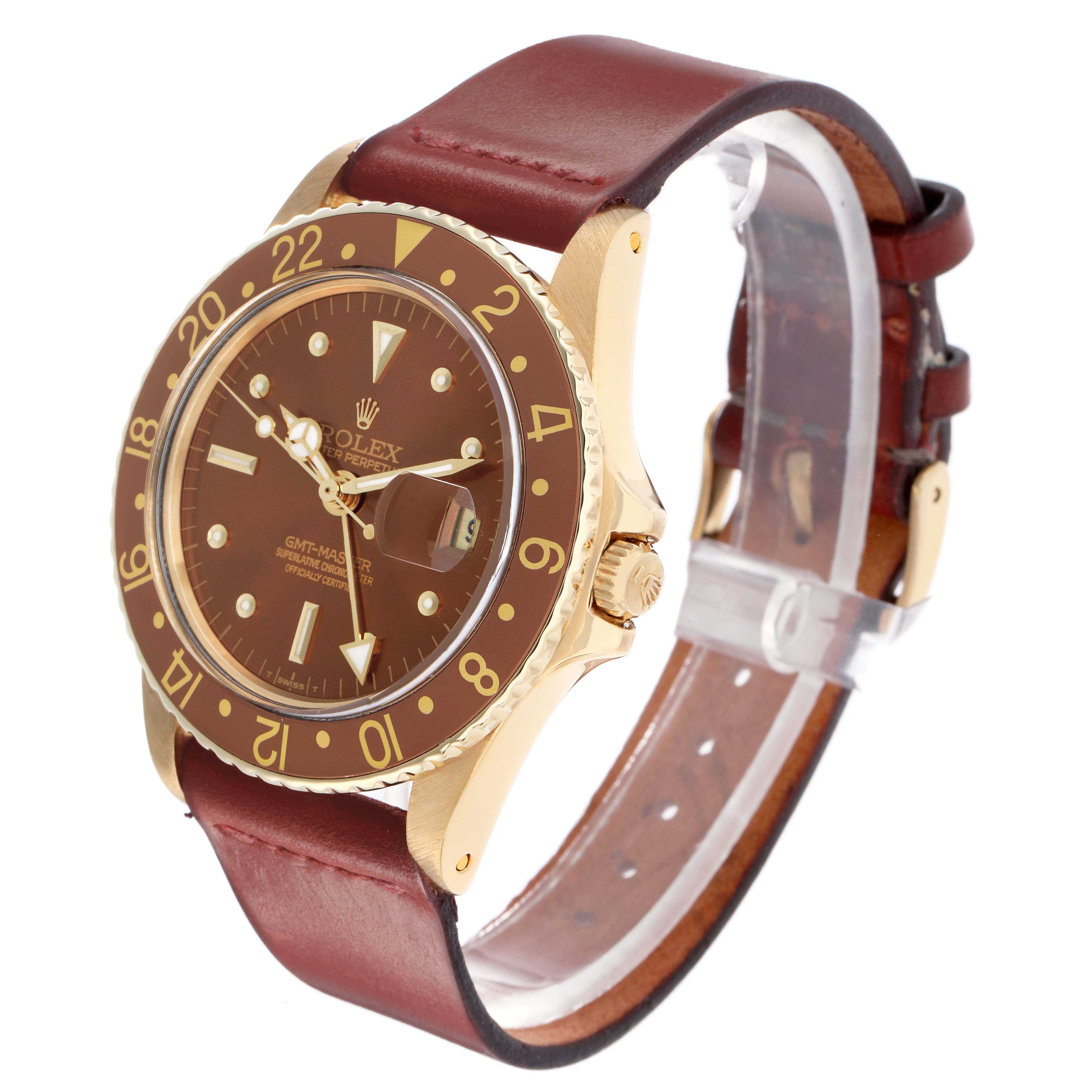 The Rolex GMT-Master 1675 Men
s Yellow Gold Brown Dial watch is shown at a three-quarter angle, highlighting the bezel, dial, crown, and leather strap.