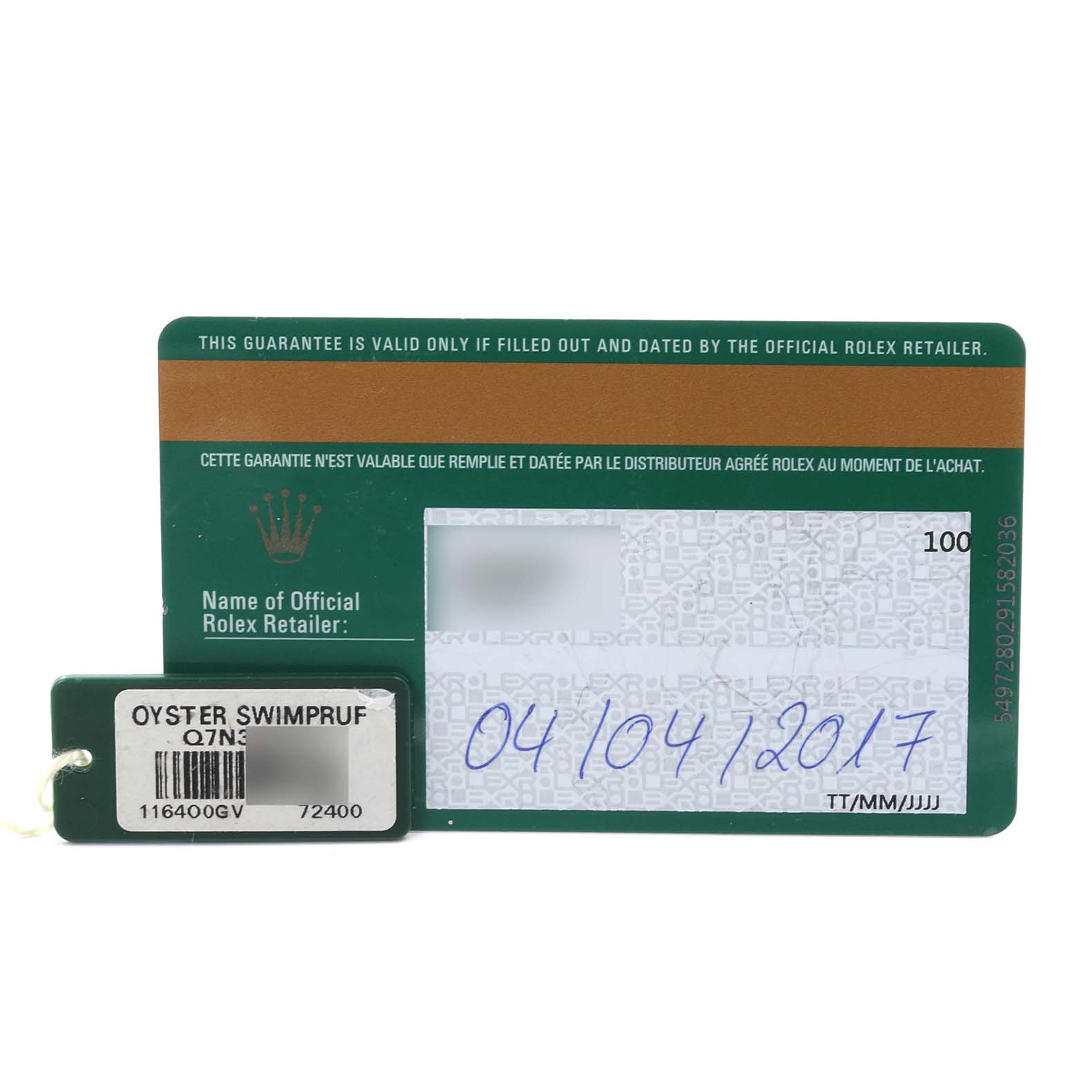 The image shows a Rolex Milgauss 116400GV Men's Stainless Steel Black Dial 116400GV Men's Stainless Steel Black Dial warranty card and a green "Oyster Swimpruf" tag from a top angle.