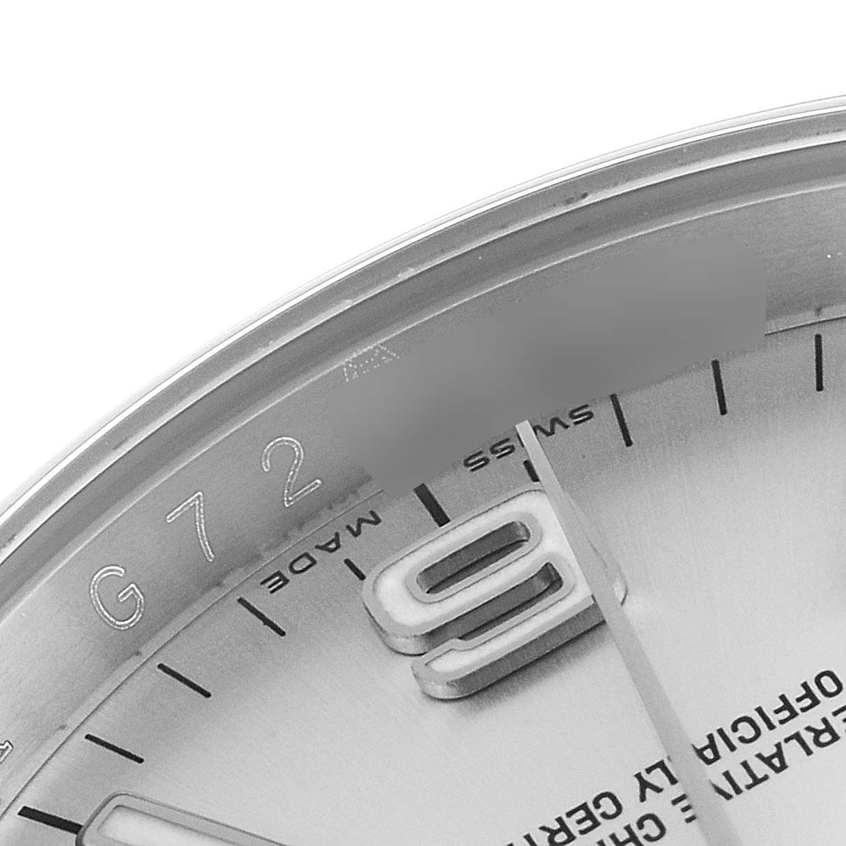 This image shows a close-up angle of the dial and partial bezel of a Rolex Oyster Perpetual 116000 Men's Stainless Steel Silver Dial 116000 Men's Stainless Steel Silver Dial watch.