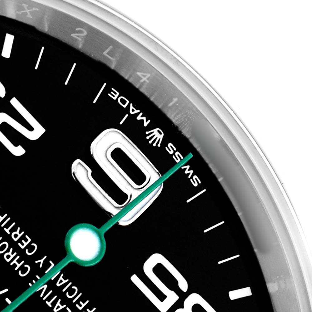 The image shows a close-up of the Rolex Air-King 126900 Men
s Stainless Steel Black Dial watch
s dial, focusing on the 3 o
clock position and partial numerals.