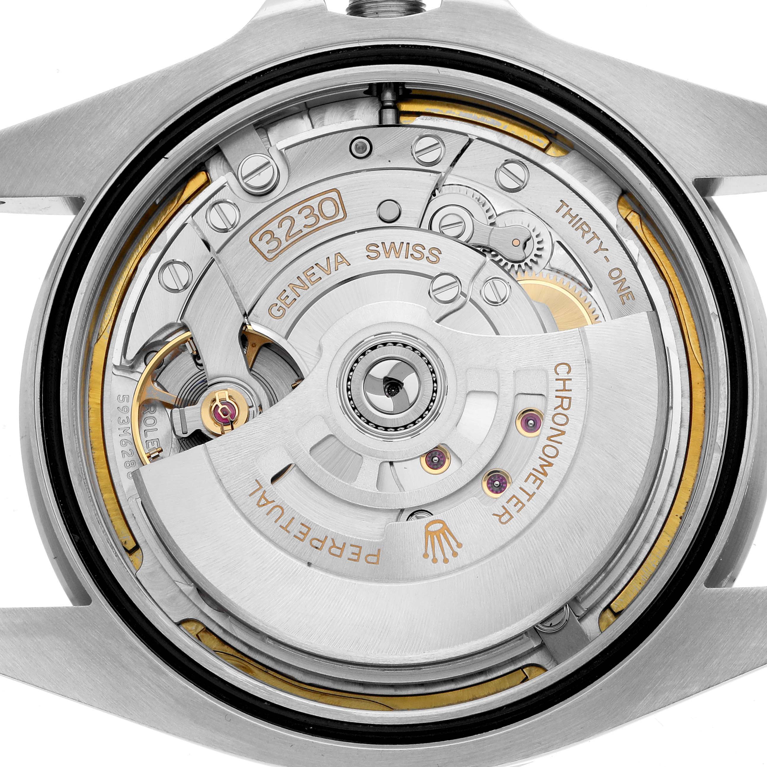 The image shows the movement of the Rolex Air-King 126900 Men
s Stainless Steel Black Dial watch from a top-down angle, highlighting the rotor and inner mechanisms.