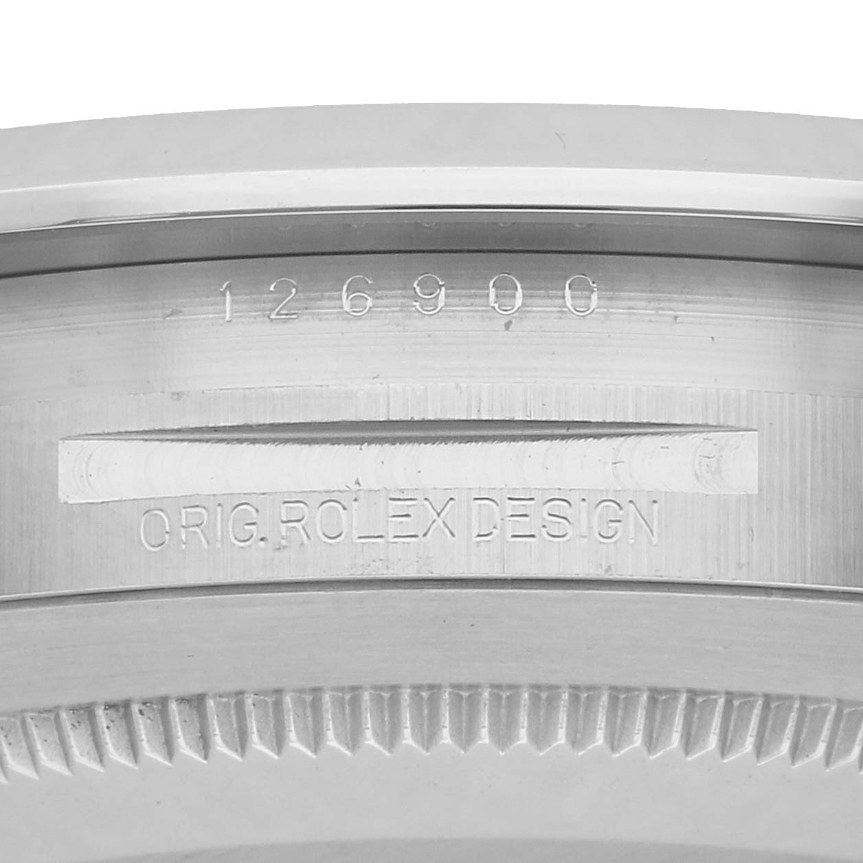 The image shows a close-up of the bezel and engraved details on the Rolex Air-King 126900 Men
s Stainless Steel Black Dial
s case.