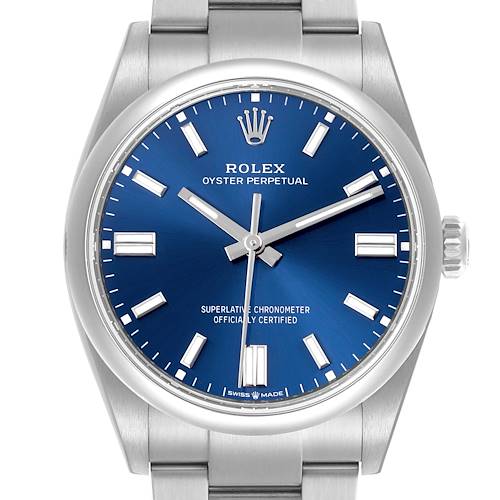 The Rolex Oyster Perpetual watch is shown from the front, displaying its blue dial, hands, indices, and part of the bracelet.