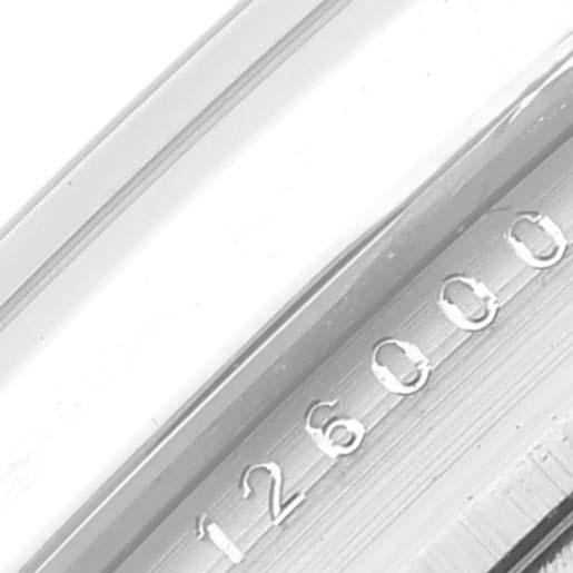 The image shows a close-up of the Oyster Perpetual Rolex
s serial number engraving on the side of the case.