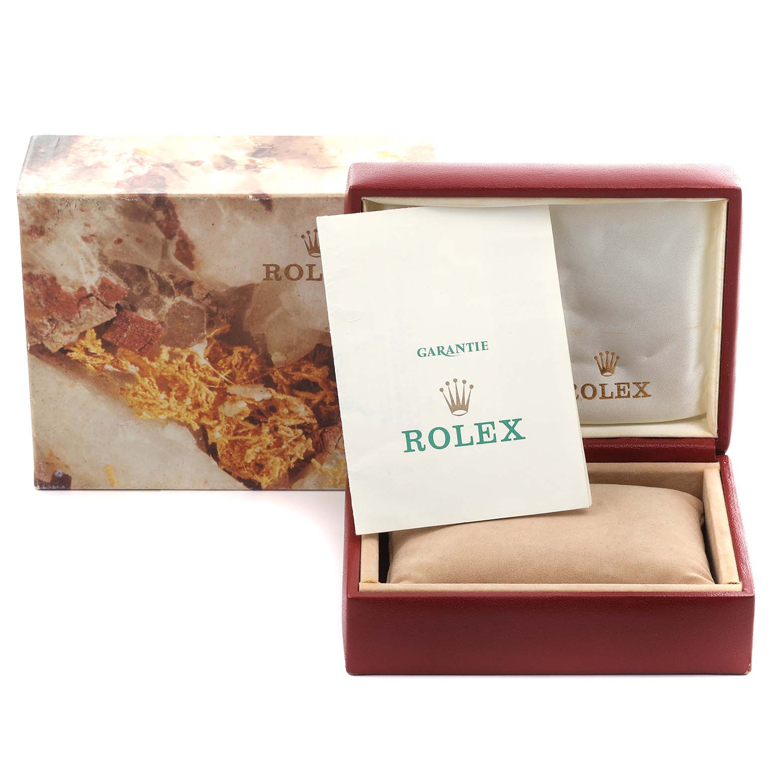 The image shows the packaging and paperwork for a Rolex Oyster Perpetual 67194 Women's Stainless Steel White Dial 67194 Women's Stainless Steel White Dial, including the box and guarantee card.