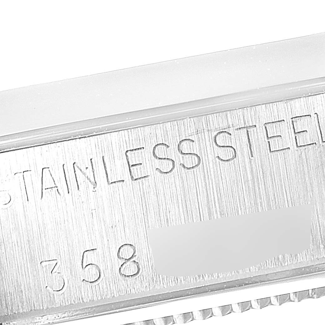 The image shows a close-up of the stainless steel case with an engraved serial number on a Rolex Vintage Collection 6694 Men
s Stainless Steel Silver Dial 6694 Men
s Stainless Steel Silver Dial watch.