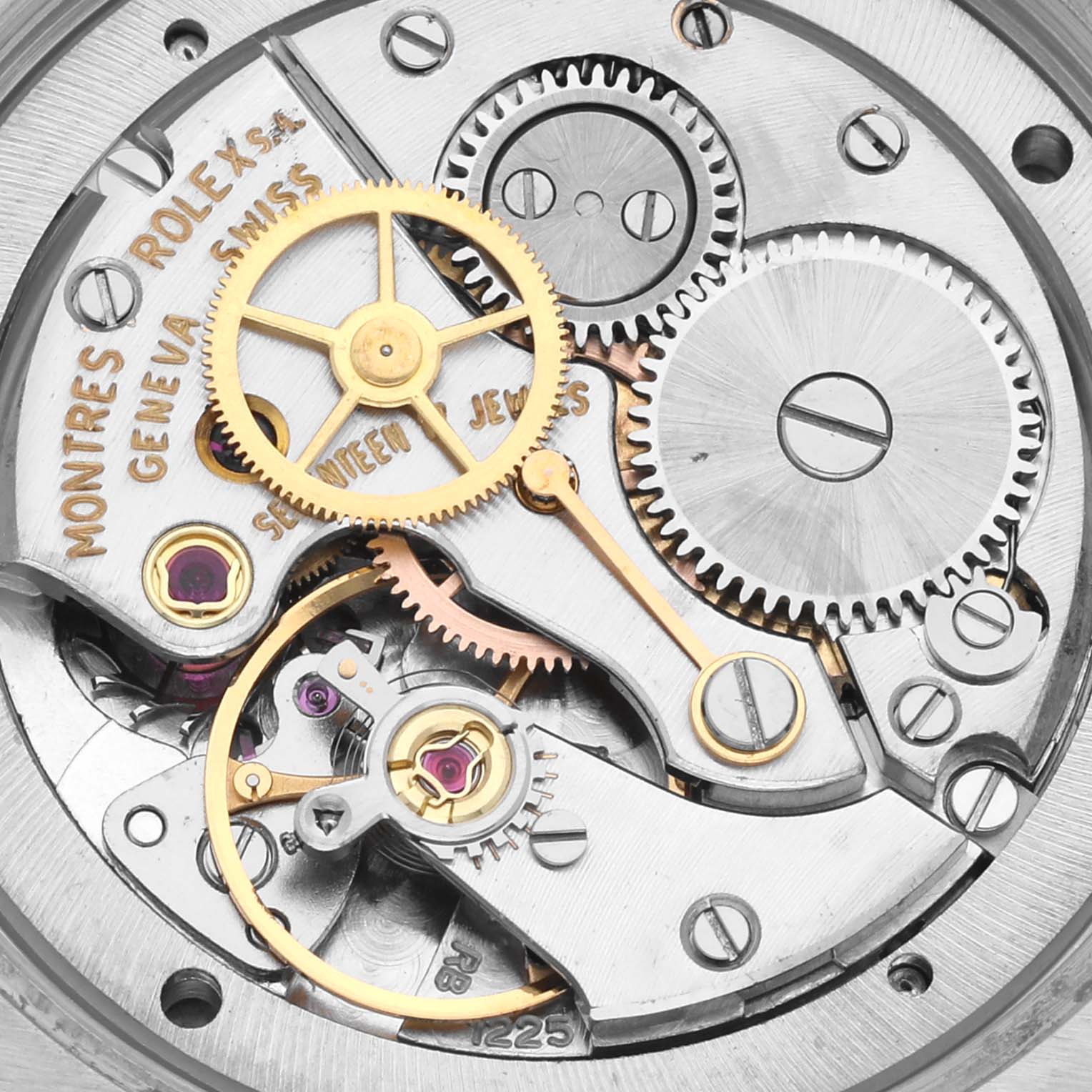 The image shows an overhead view of the Rolex Vintage Collection 6694 Men's Stainless Steel Silver Dial 6694 Men's Stainless Steel Silver Dial watch movement, highlighting gears and intricate mechanics.