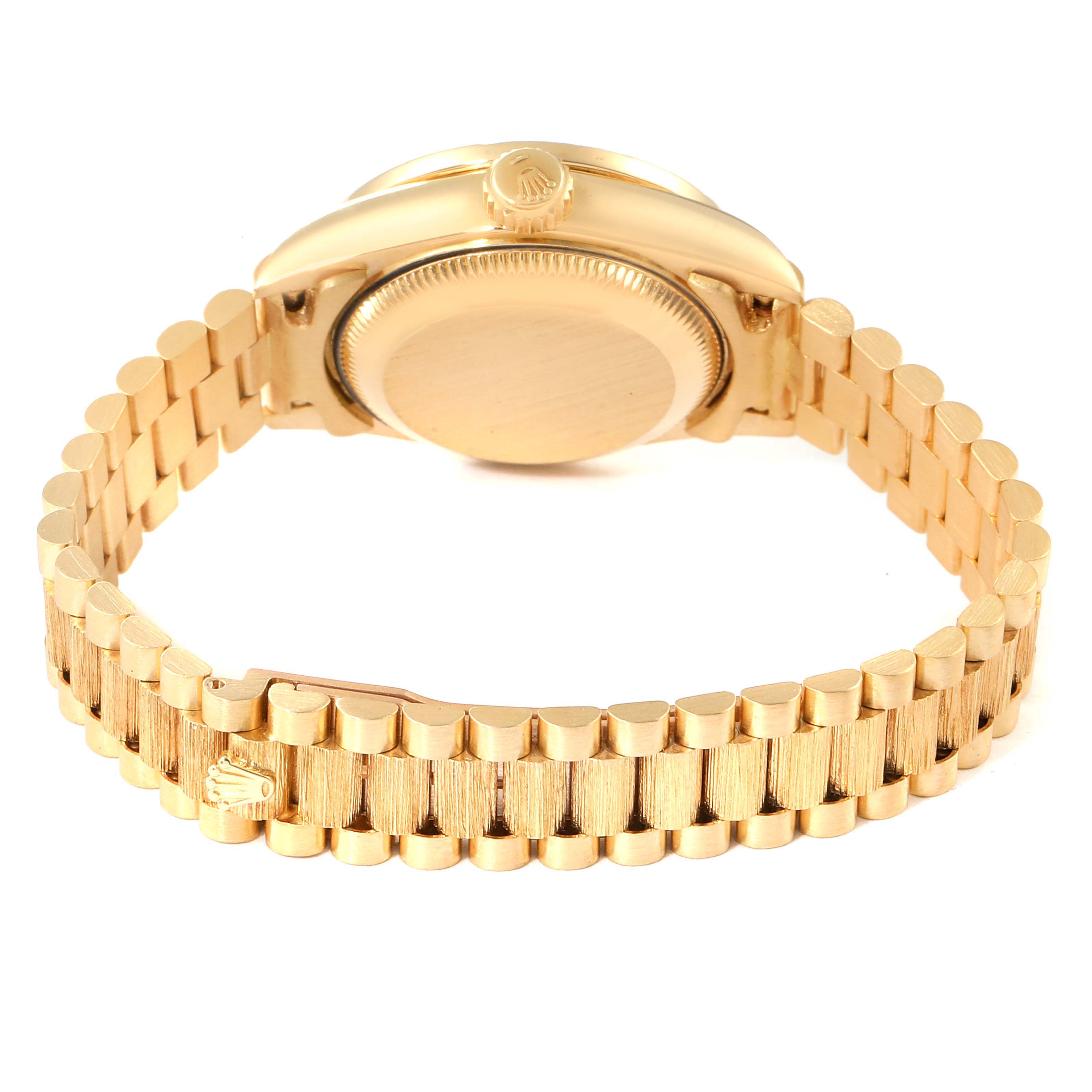 This image shows the back case and bracelet of a Rolex President 69288 Women
s Yellow Gold Champagne Dial 69288 Women
s Yellow Gold Champagne Dial model watch, focusing on the gold design and clasp.