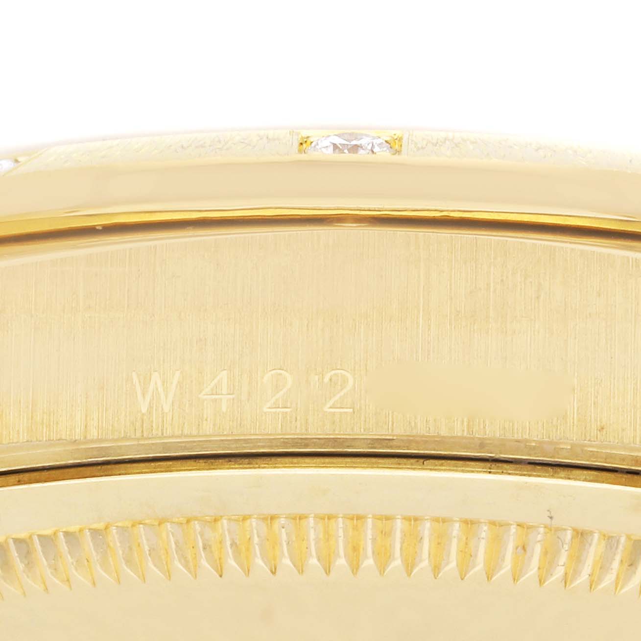 The image shows a close-up of the side engraving and fluted bezel of a Rolex President 18308 Men
s Yellow Gold Champagne Dial 18308 Men
s Yellow Gold Champagne Dial model watch.