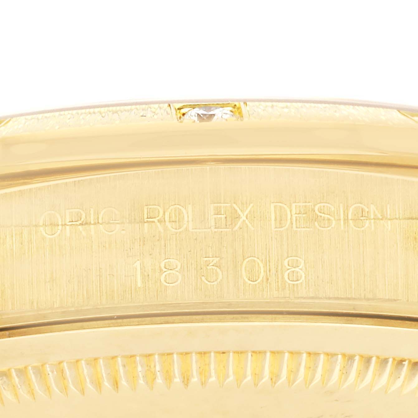 The image shows the side of the Rolex President 18308 Men
s Yellow Gold Champagne Dial 18308 Men
s Yellow Gold Champagne Dial model, focusing on the engraved reference number.