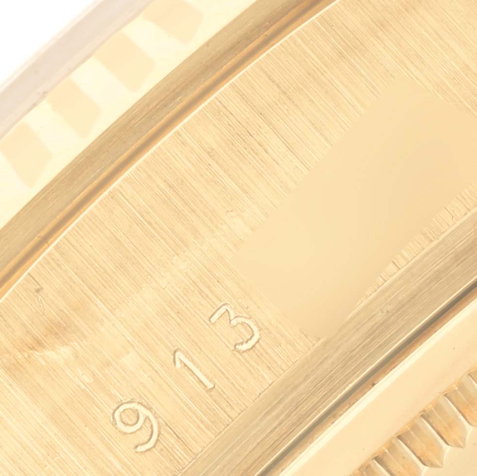 The image shows a close-up of the case
s serial number area of the Rolex President 18038 Men
s Yellow Gold Champagne Dial 18038 Men
s Yellow Gold Champagne Dial model.