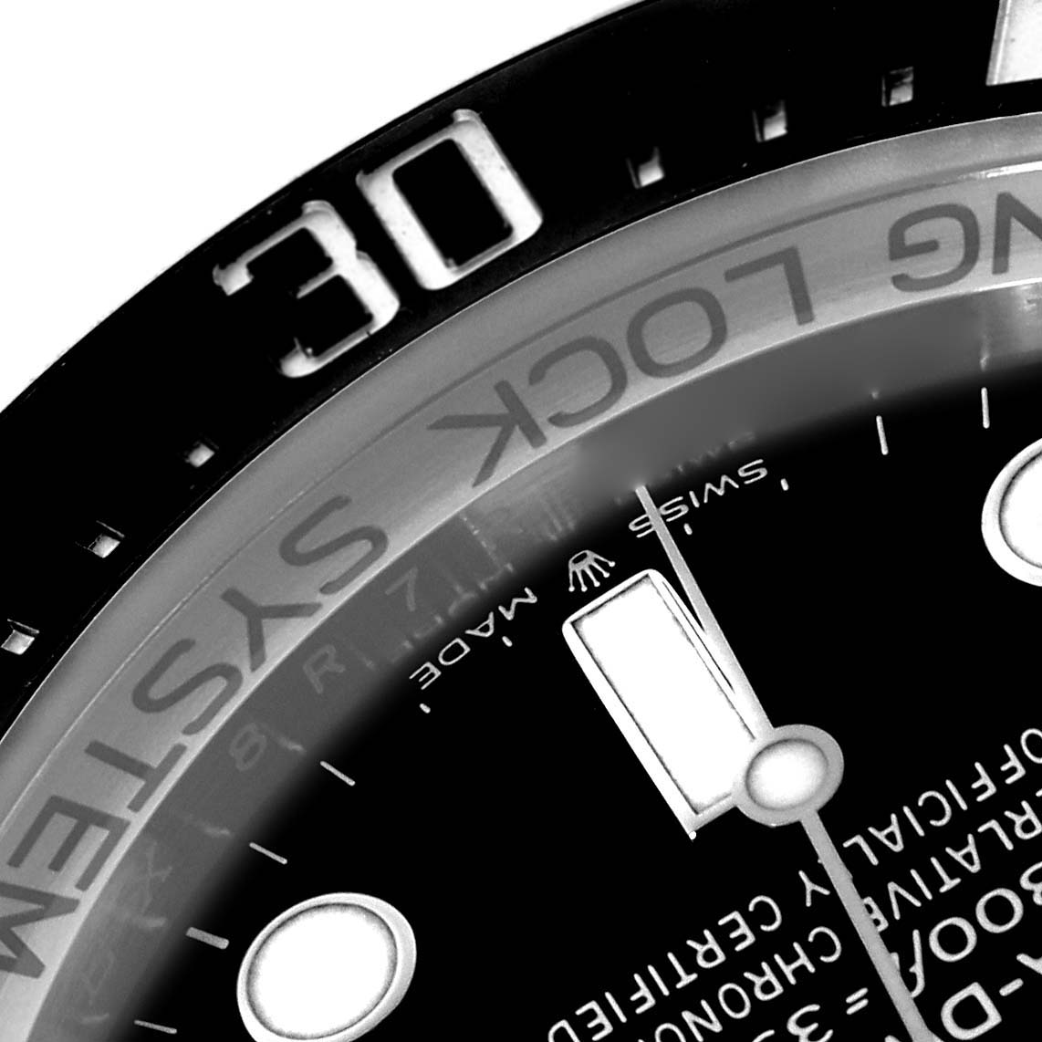 The image shows a close-up of the bezel, dial, and part of the hour hand of a Rolex Sea-Dweller 136660 Men's Stainless Steel Black Dial 136660 Men's Stainless Steel Black Dial.