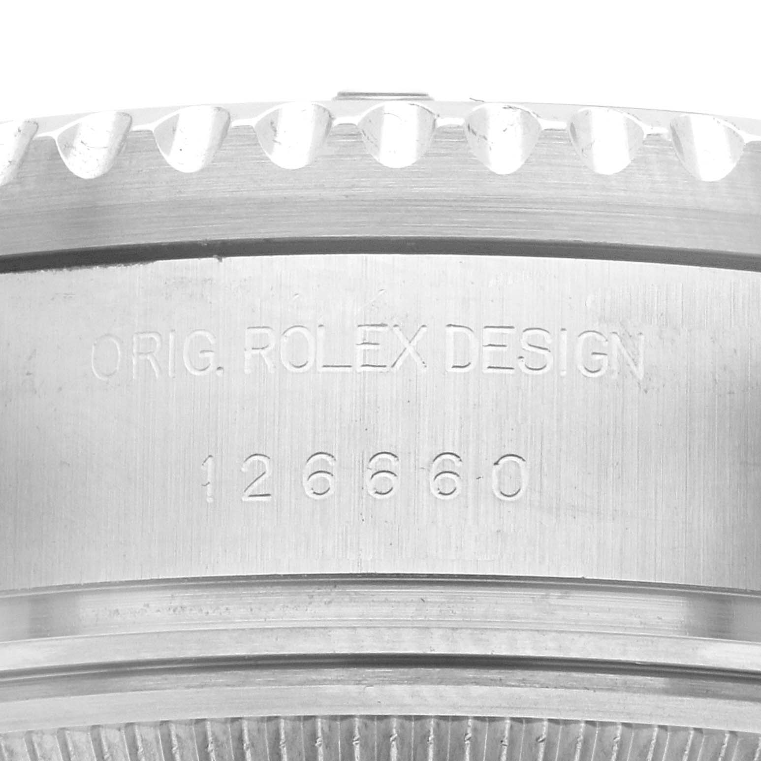 The image shows a close-up of the engraved side of the Rolex Sea-Dweller 126660 Men's Stainless Steel Blue Dial, highlighting the model number.