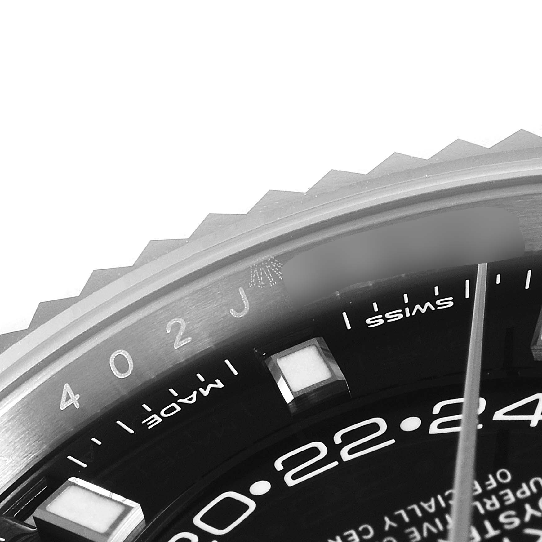 The image showcases a close-up angle of the Rolex Sky-Dweller 326934 Men's Stainless Steel Black Dial 326934 Men's Stainless Steel Black Dial's bezel, dial, and partial hour markers.