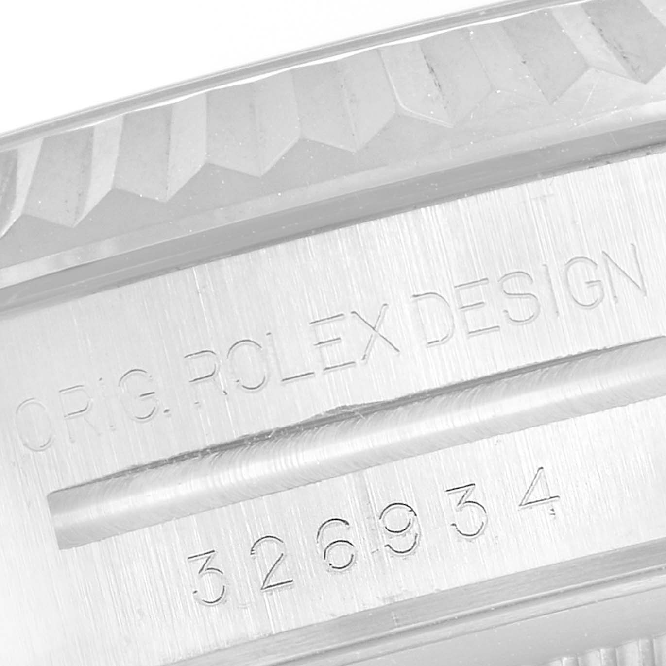 The image shows an engraved part of a Rolex Sky-Dweller 326934 Men's Stainless Steel Blue Dial 326934 Men's Stainless Steel Blue Dial watch, highlighting the model number and 'Rolex Design' text.