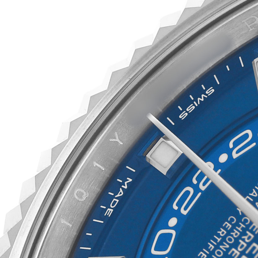 The image shows a close-up of the blue dial and fluted bezel of the Rolex Sky-Dweller 326934 Men's Stainless Steel Blue Dial.