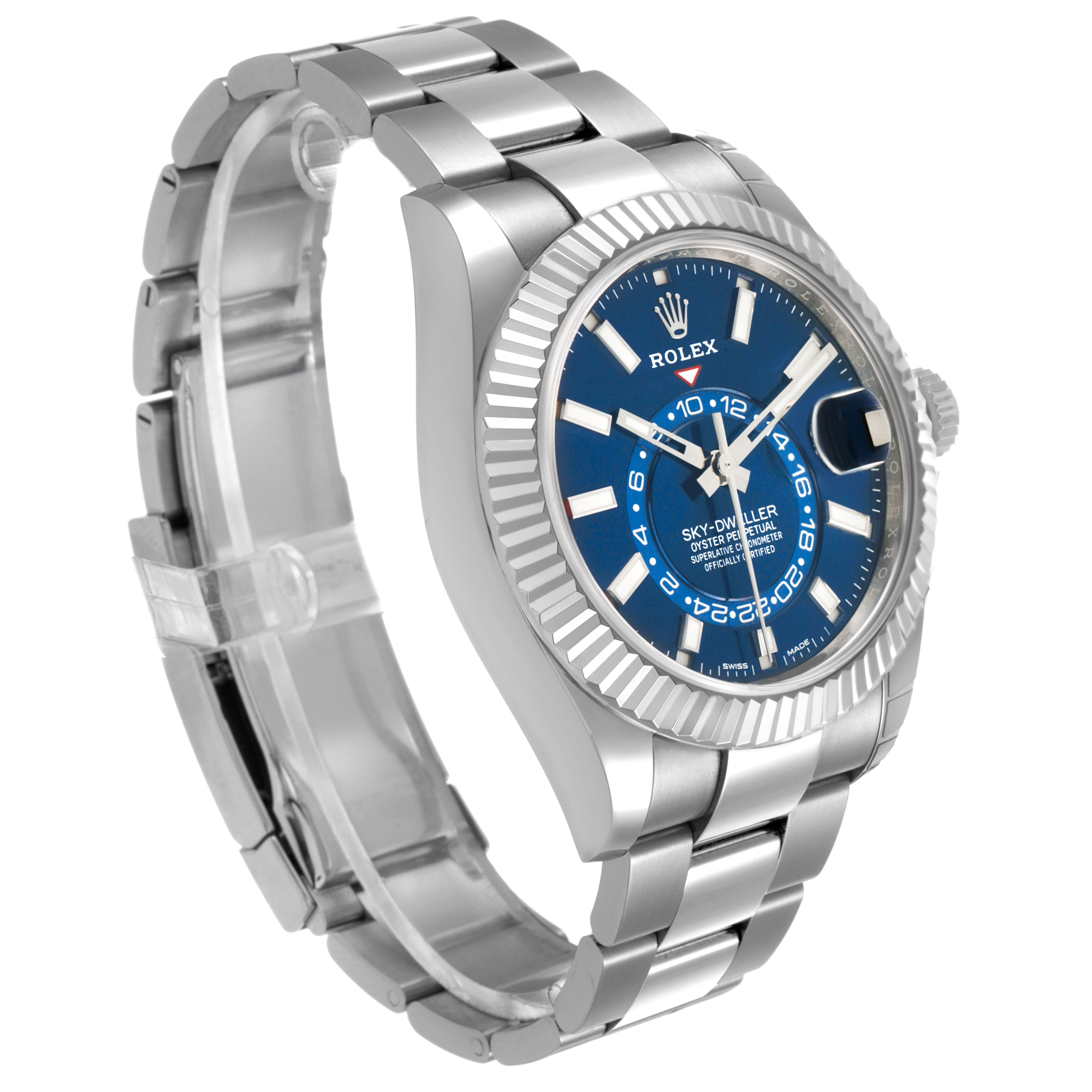 The Rolex Sky-Dweller 326934 Men's Stainless Steel Blue Dial watch is shown at an angle highlighting the blue dial, fluted bezel, and metal bracelet.