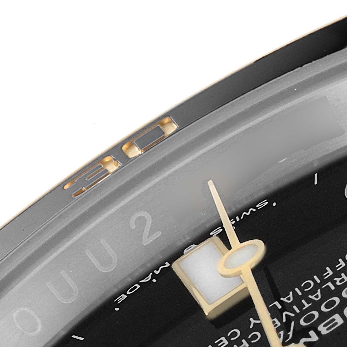 The image shows a close-up of the Rolex Submariner 126613 Men's Steel and Gold (two tone) Black Dial 126613 Men's Steel and Gold (two tone) Black Dial watch dial, highlighting the minute hand and part of the chapter ring.