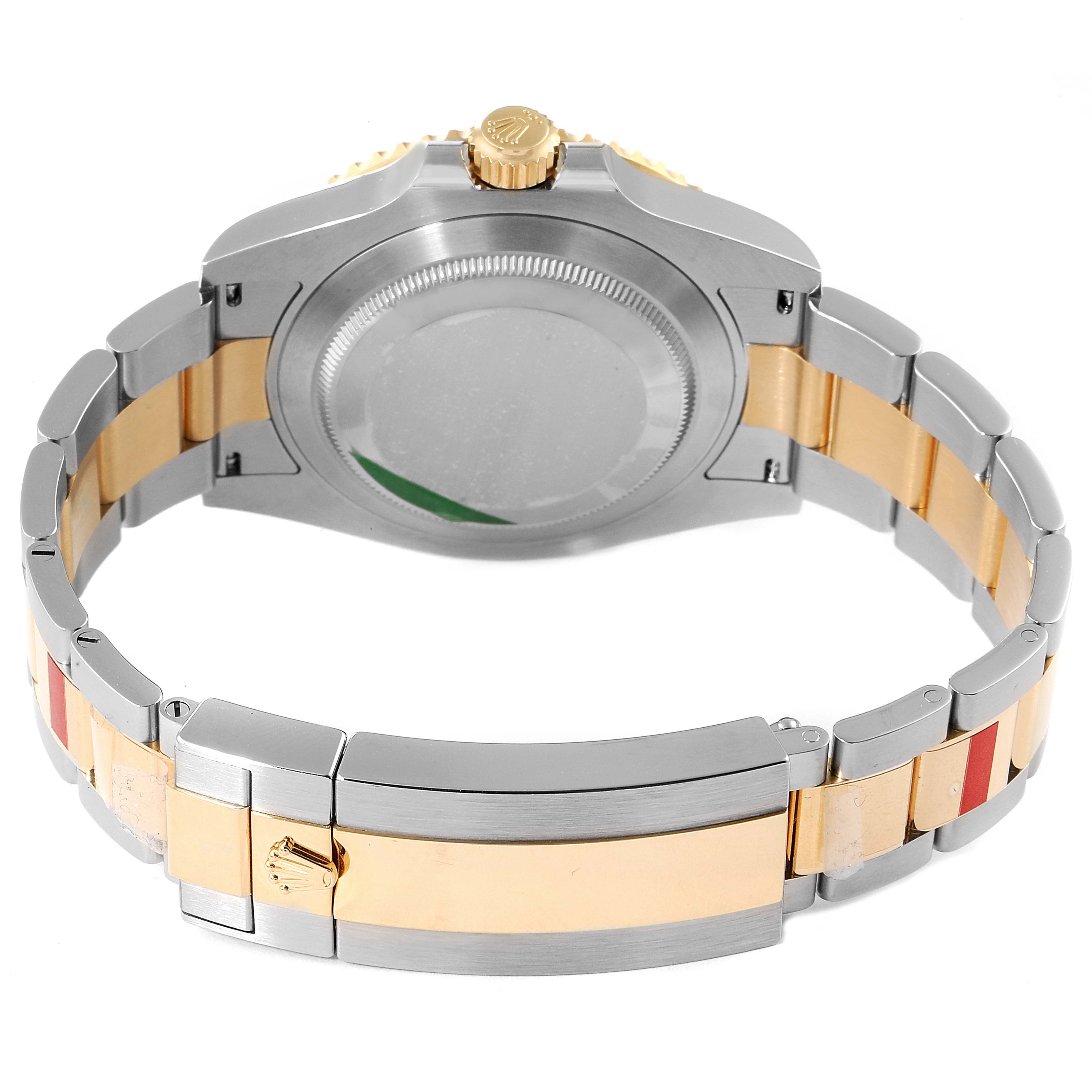 The image shows the back view of a Rolex Submariner 126613 Men's Steel and Gold (two tone) Black Dial 126613 Men's Steel and Gold (two tone) Black Dial watch, highlighting the bracelet and case back.