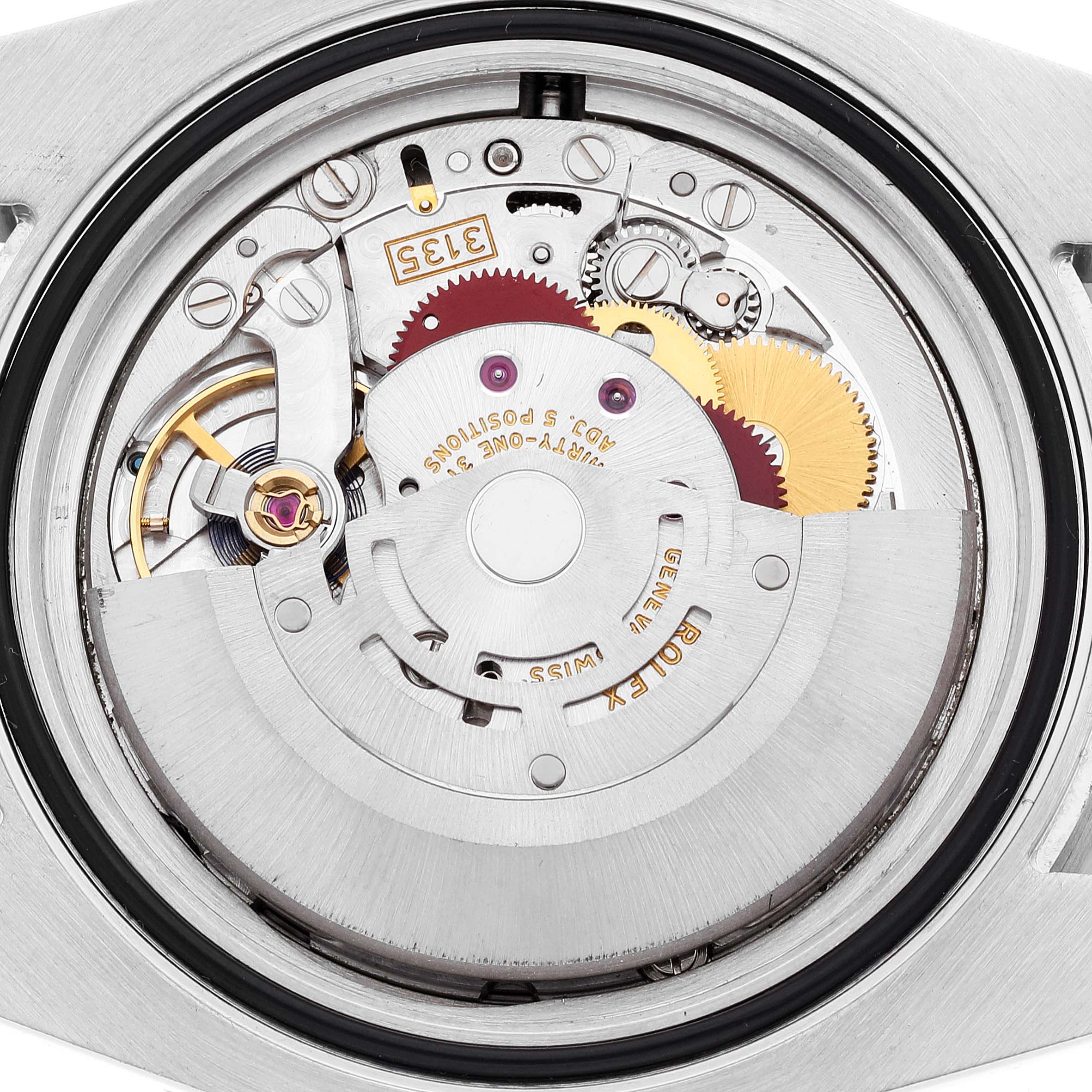 The image shows the intricate inner mechanics of the Rolex Submariner 116610 Men
s Stainless Steel Black Dial 116610 Men
s Stainless Steel Black Dial watch from a back view, highlighting its gears and rotor.