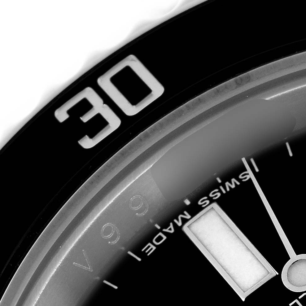 This close-up image of a Rolex Submariner 116610 Men
s Stainless Steel Black Dial 116610 Men
s Stainless Steel Black Dial watch shows the bezel with the "30" marking and part of the dial with "SWISS MADE" text.