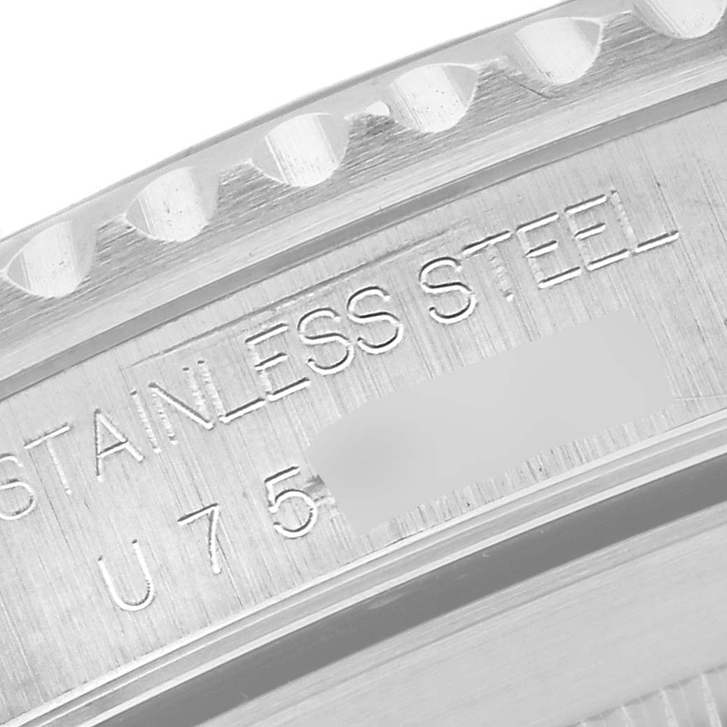 The image shows a close-up angle of the engraved case back of a Rolex Submariner 14060 Men
s Stainless Steel Black Dial 14060 Men
s Stainless Steel Black Dial, highlighting the stainless steel material.