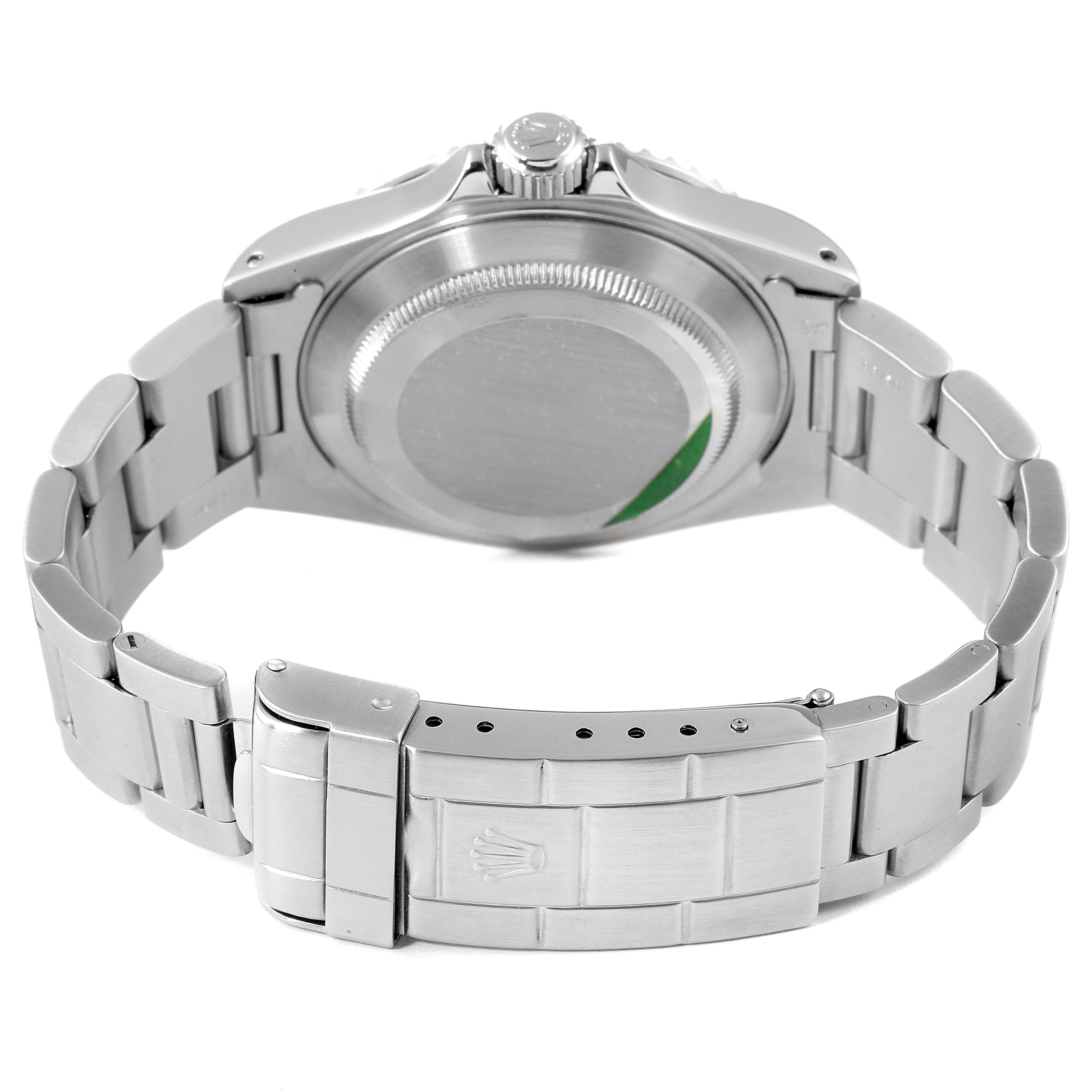 This image shows the backside and bracelet of a Rolex Submariner 14060 Men
s Stainless Steel Black Dial 14060 Men
s Stainless Steel Black Dial watch from a rear angle.