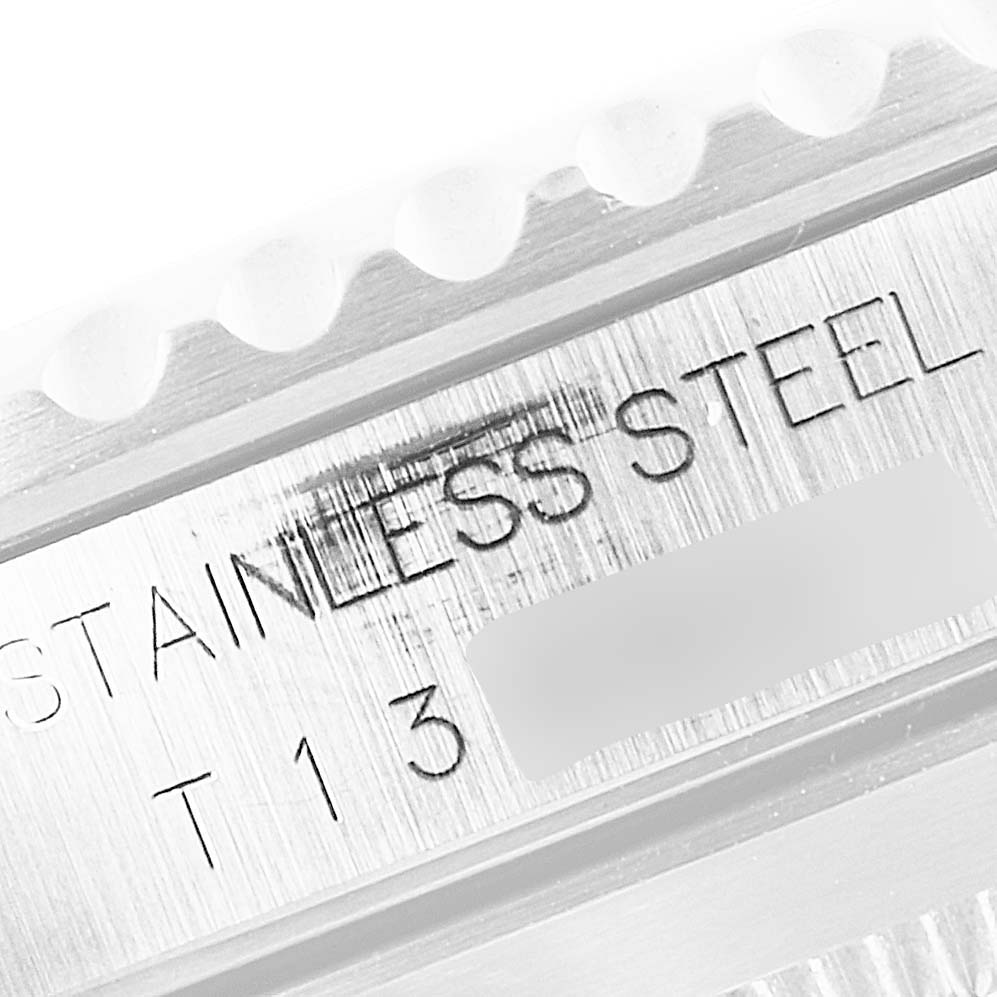 The image shows a close-up angle of the bezel and case of the Rolex Submariner 14060 Men
s Stainless Steel Black Dial 14060 Men
s Stainless Steel Black Dial, highlighting the "STAINLESS STEEL" engraving.