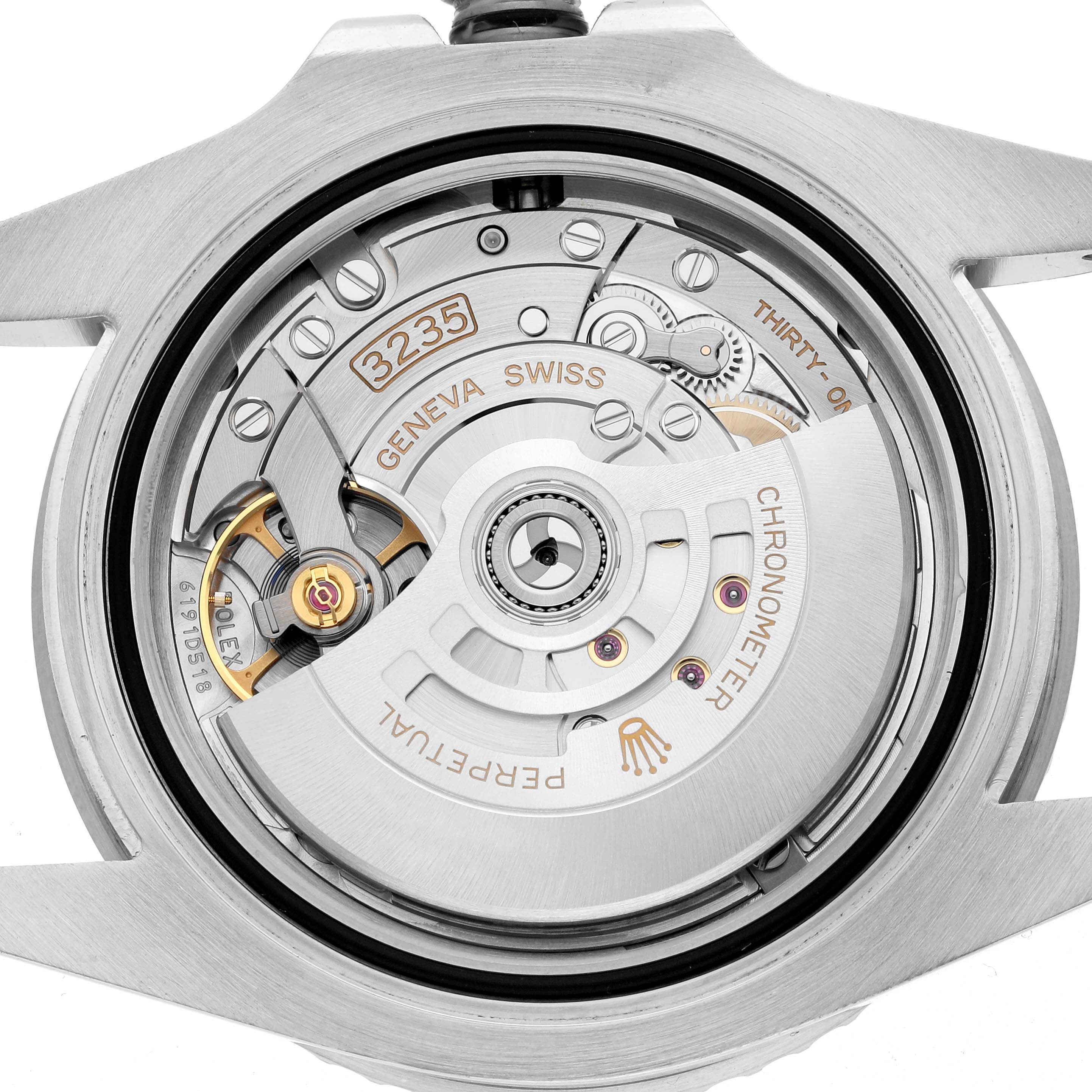 The image shows the movement of a Rolex Submariner 126610 Men
s Stainless Steel Black Dial, viewed from the back, displaying its intricate mechanical components.