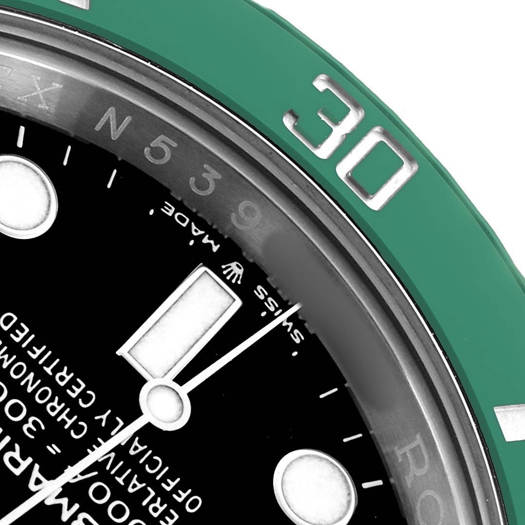The image shows a close-up of the Rolex Submariner 126610 Men
s Stainless Steel Black Dial
s dial, bezel, and part of the hour hand at an angled view.
